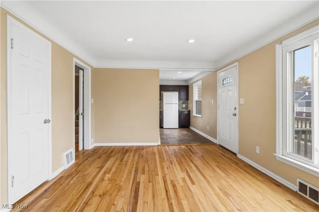 Foyer with light wood-type flooring, healthy amount of natural light, and recessed lighting