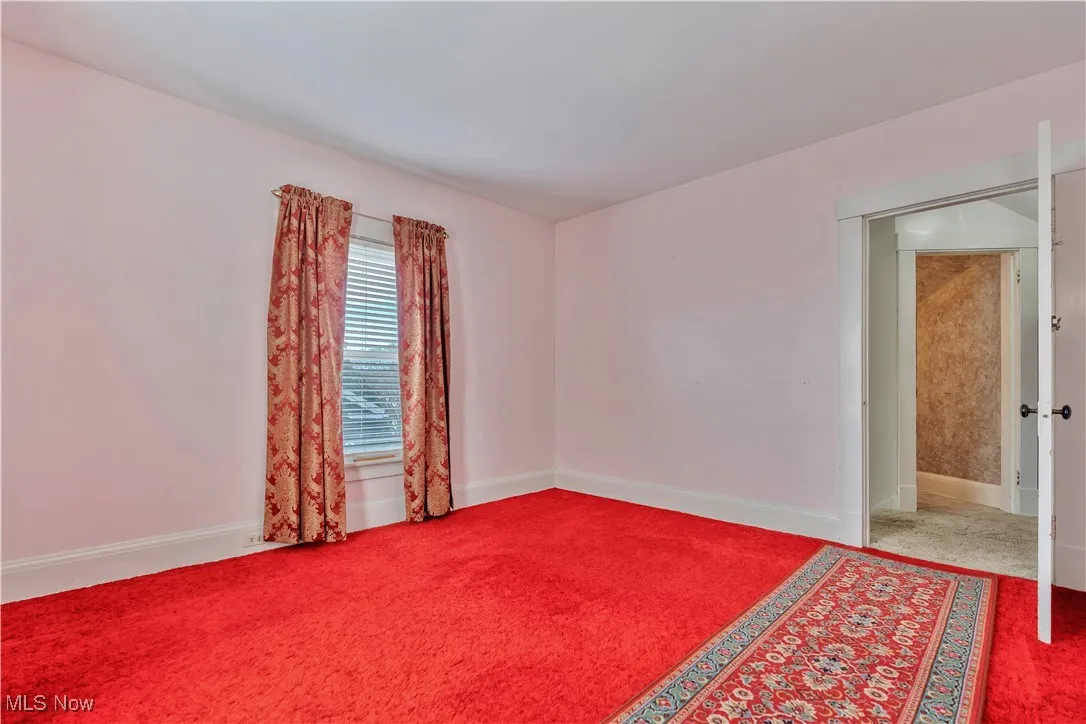 Carpeted bedroom 1 with closet
