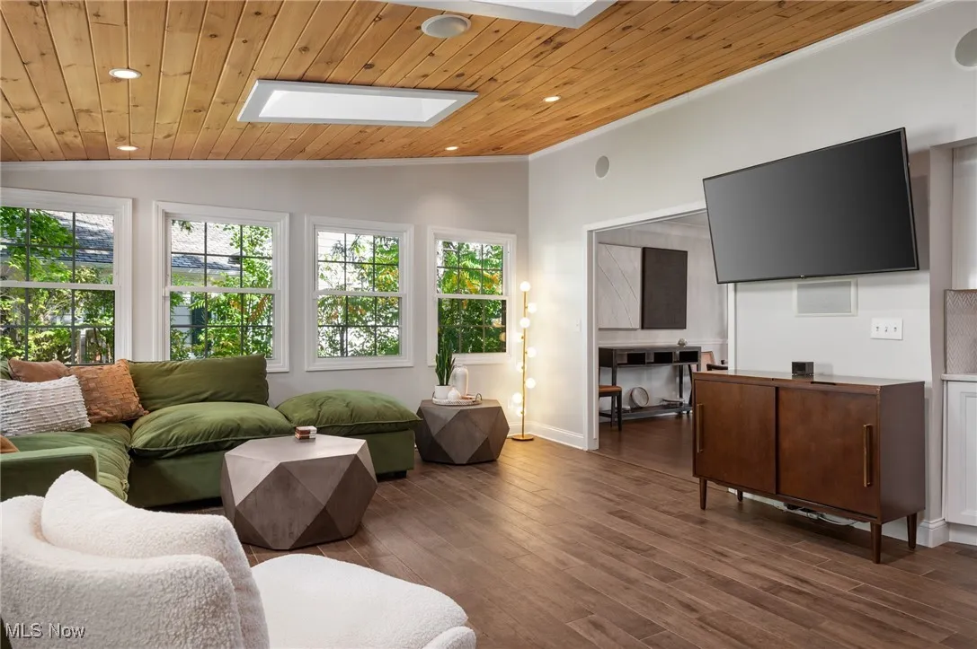 Enjoy two walls of windows to the backyard, surround sound, direct access to the patio, and a sophisticated wood ceiling.