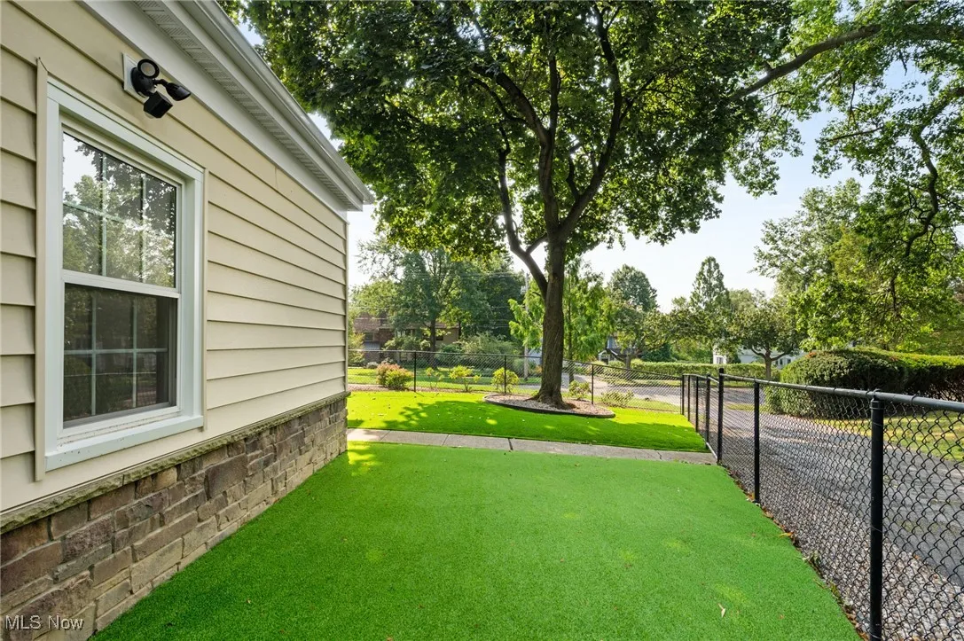 A smart doggy door allows access to this fenced-in space and dogs come back inside without muddy paws!