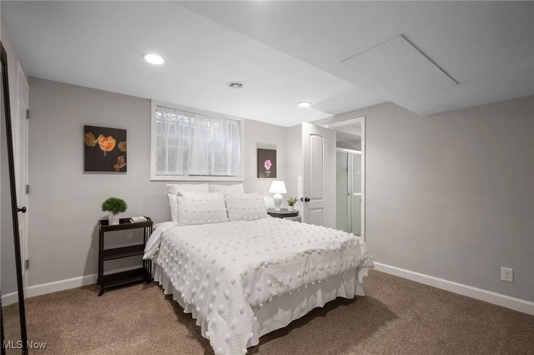 The downstairs bedroom has an en-suite bath and hosts another walk-in closet.