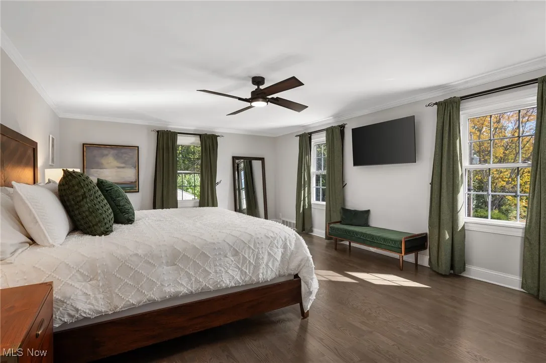 Huge primary bedroom with a walk-in closet, space for a sitting area and a dc motor fan for quiet evening breezes.