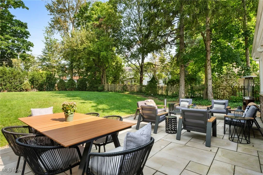 The 450 square foot Flagstone patio was created in 2023. It is surrounded by dense trees and bushes on 3 sides for added privacy.
