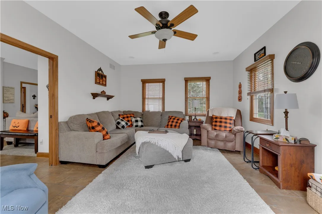 Living room featuring ceiling fan