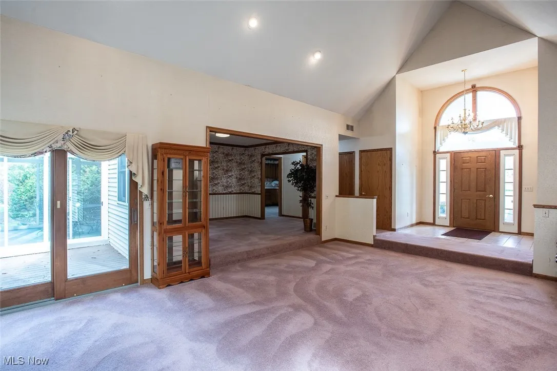 The sliding doors between he Great room and the sun room open to allow family and friends to mingle when entertaining. Step up to the formal dining area or use that space as an additional living area or an office.