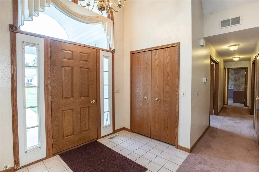 Large open grand foyer with lots of room and a large coat closet