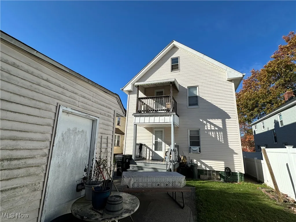Rear view of property featuring a balcony