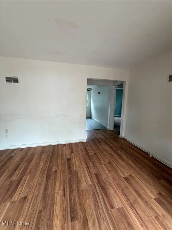 Unfurnished room with wood finished floors