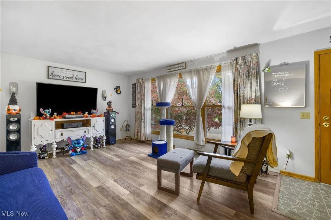 Living area with large window and LVT flooring