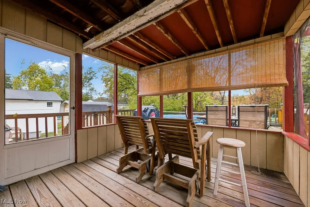 Sunroom with a wooden deck