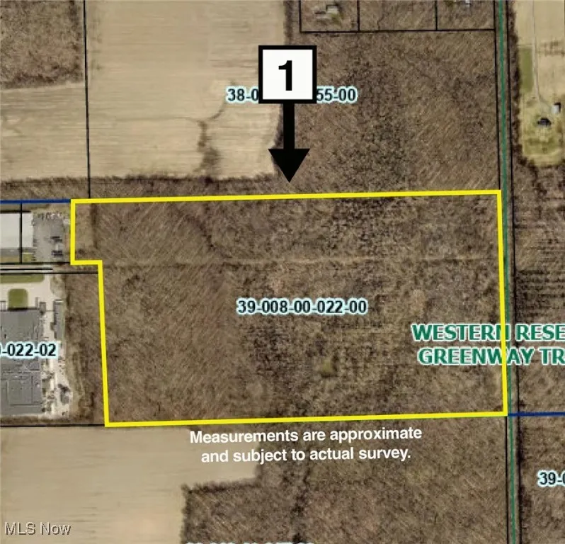 Aerial map of property and surrounding area featuring property parcel outlined