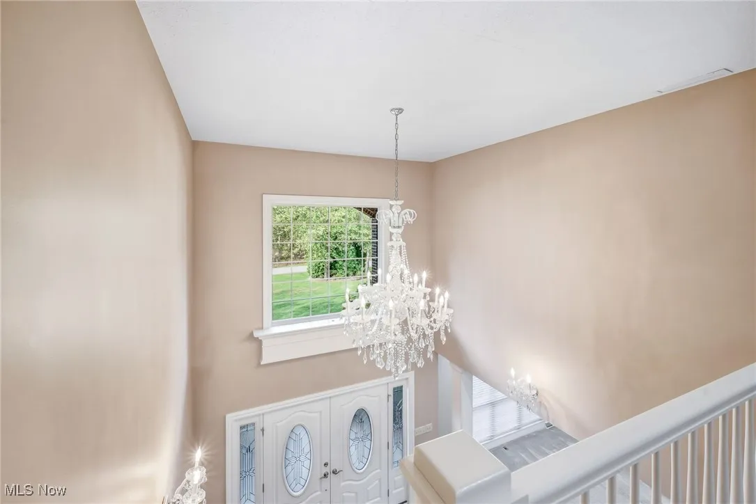 foyer with crystal chandelier