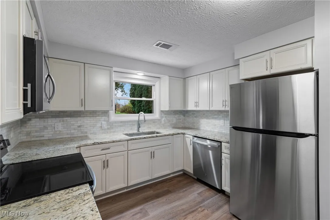 Higher end cabinets, granite countertops and gorgeous new stainless steel appliances