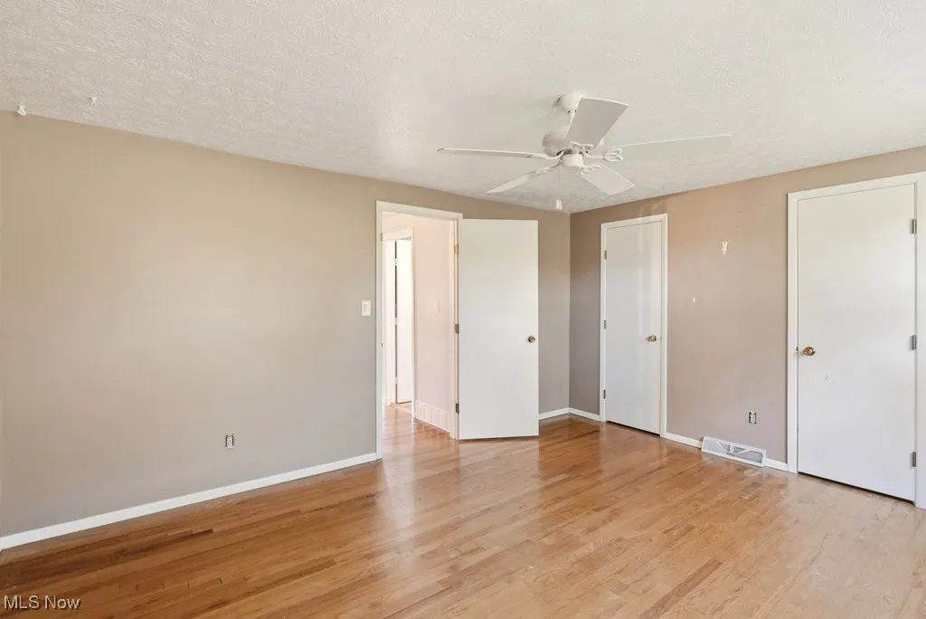 Primary bedroom with dual closets
