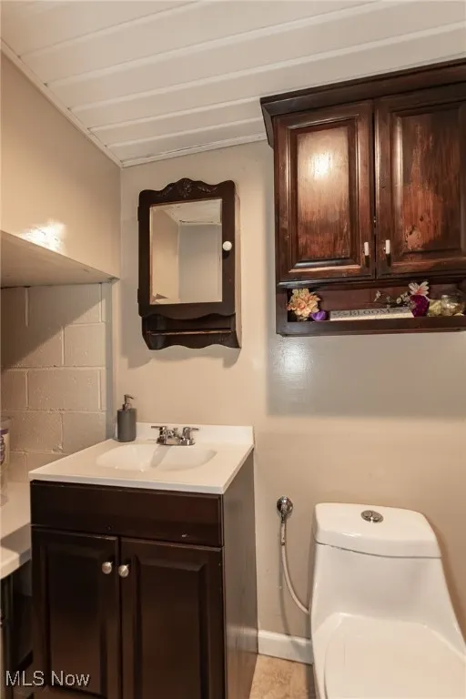 Bathroom with toilet and vanity