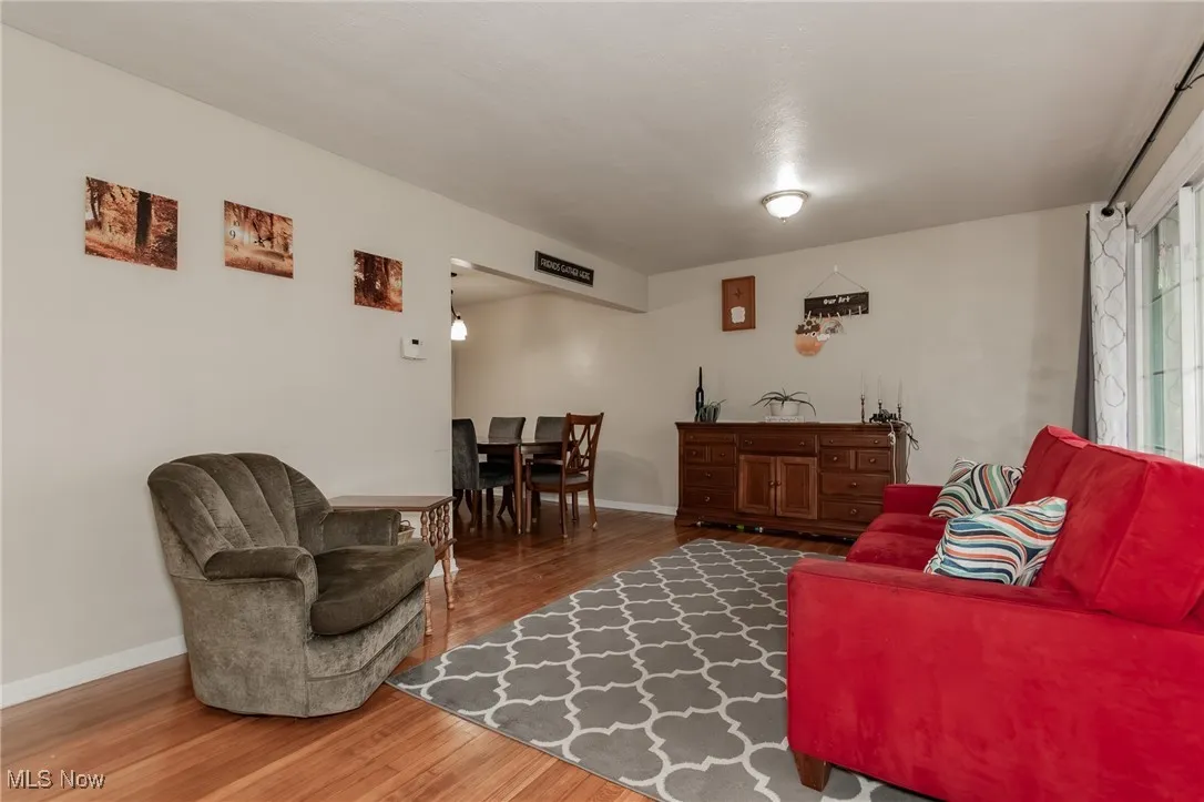 Living area featuring wood finished floors and baseboards