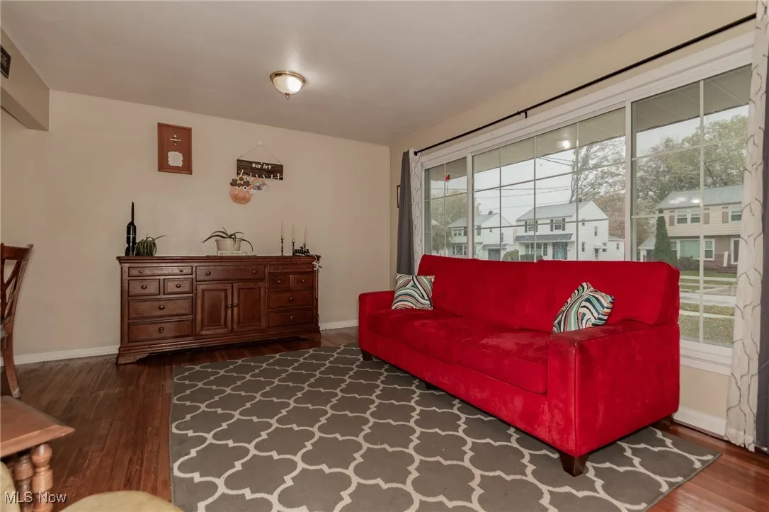 Living room featuring baseboards and dark wood finished floors