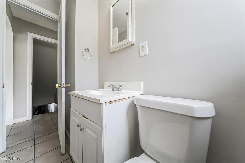 Bathroom with vanity and light tile patterned flooring