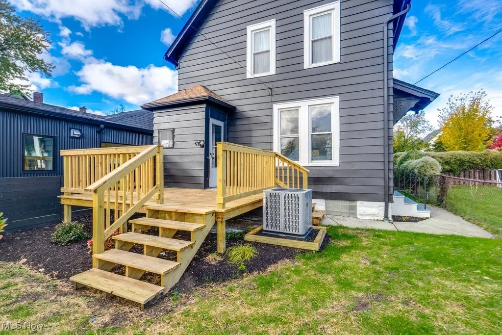 Back of property with a wooden deck