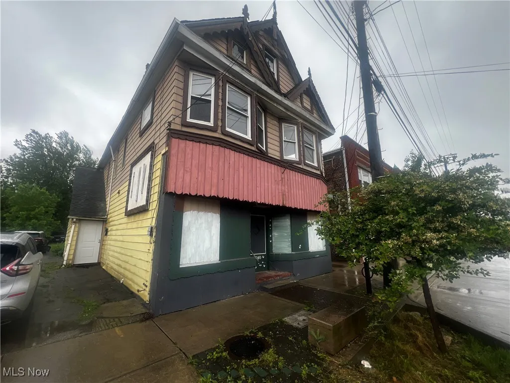 View of property exterior with a garage