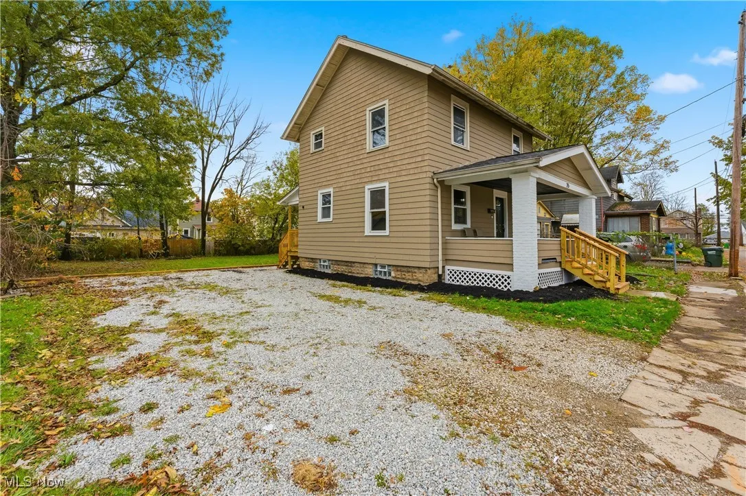 Back of house featuring a porch