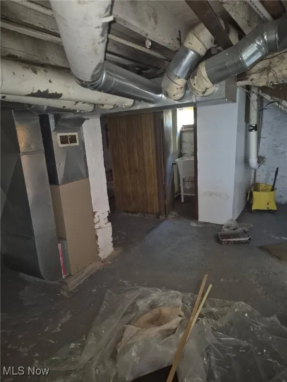 Below grade area featuring heating unit