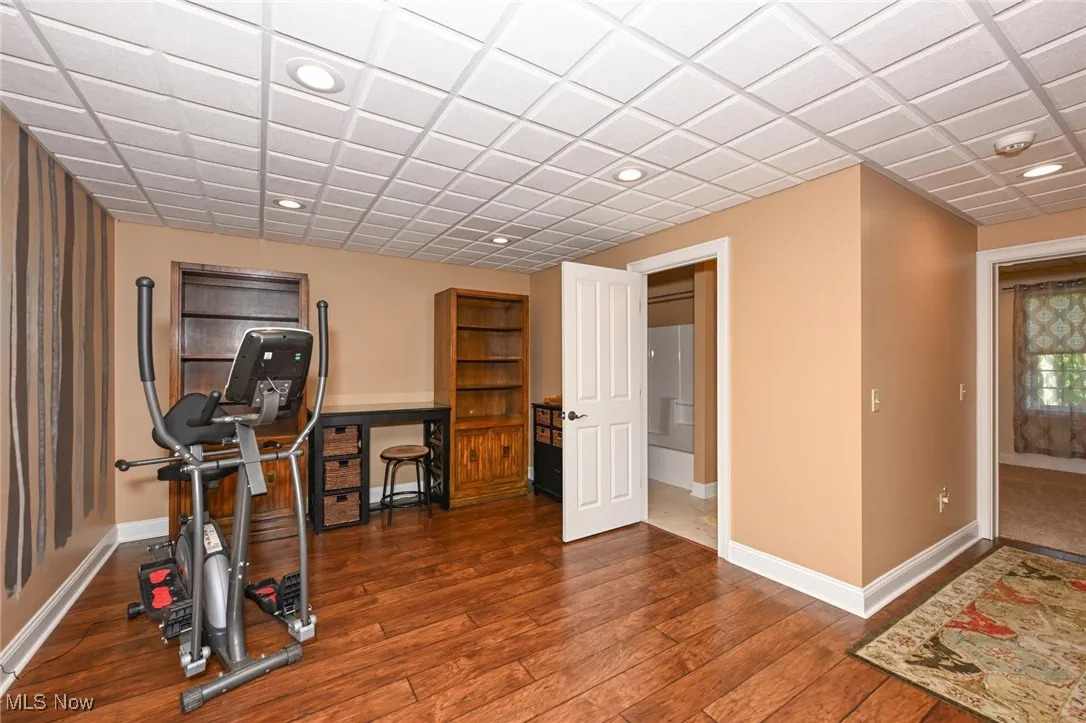 Workout area with recessed lighting and wood-type flooring