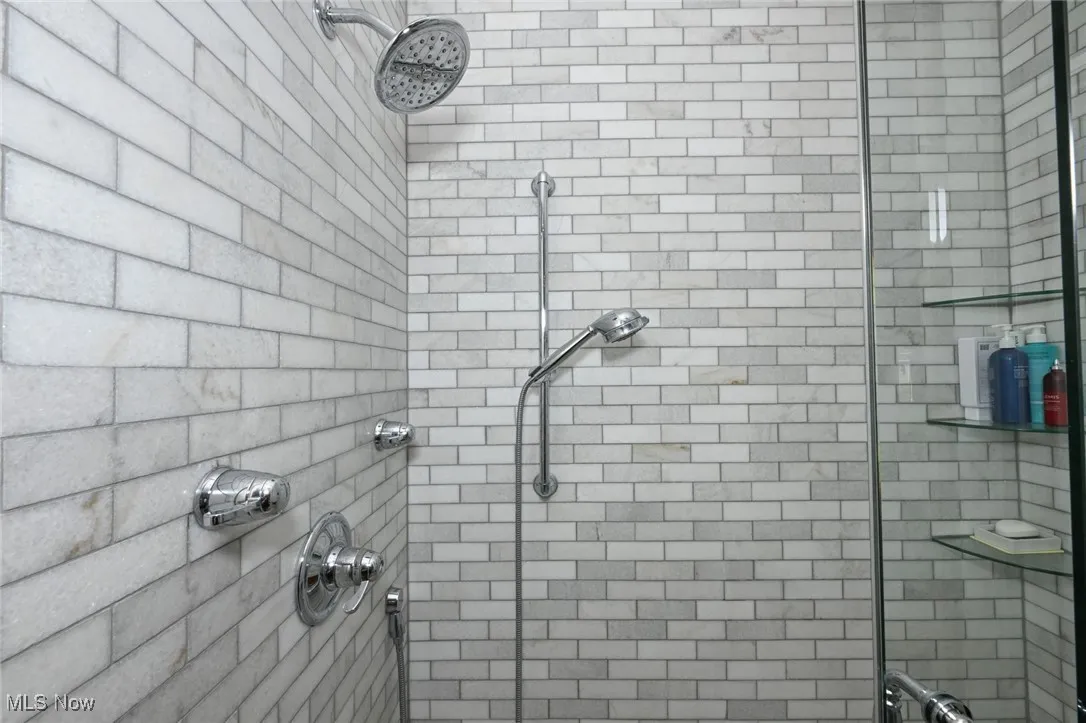Bathroom featuring tiled shower