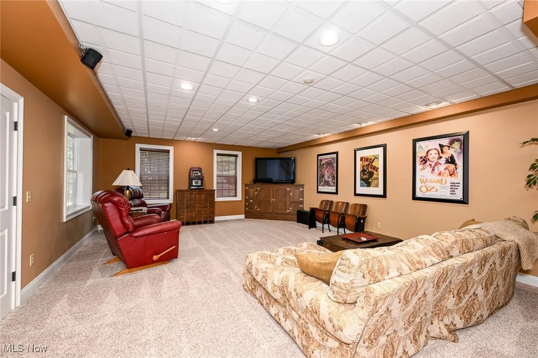 Living area featuring light carpet and recessed lighting