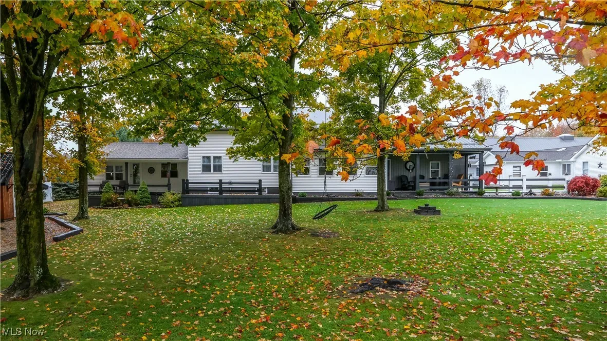 Back of property with a porch