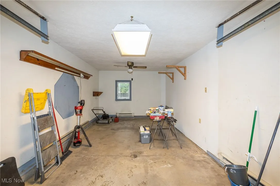 Below grade area featuring a garage and a textured ceiling