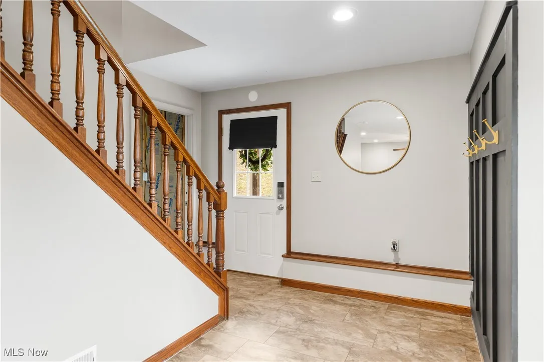 Front door into family room and stairs going to main floor
