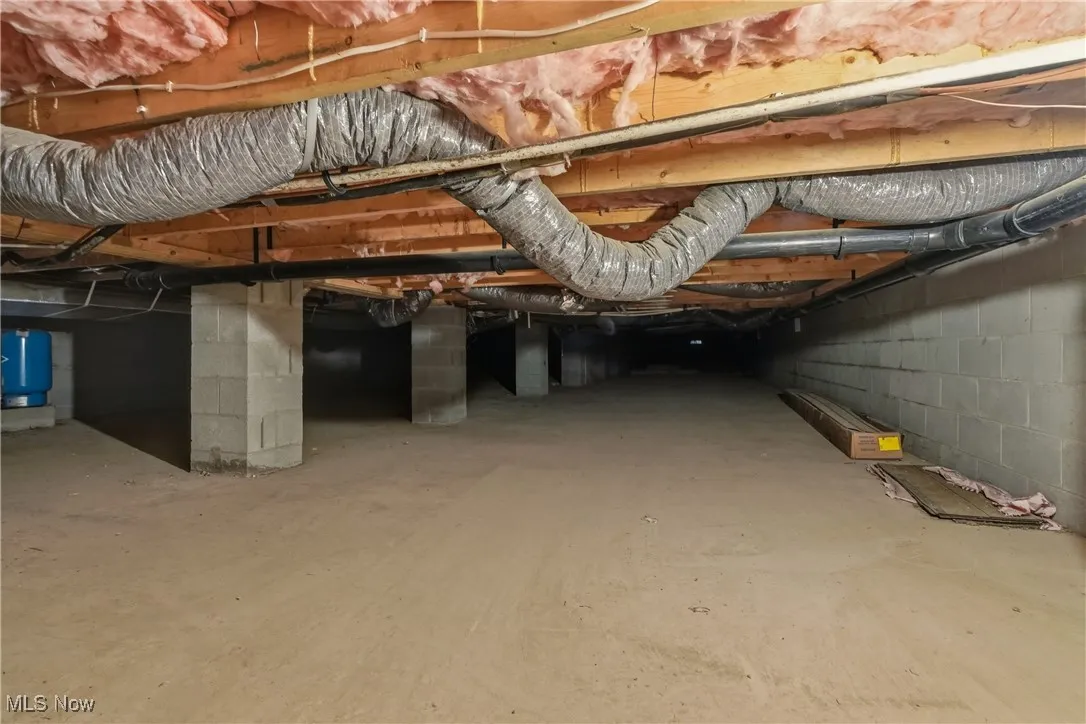 crawl space and a water pressure tank
