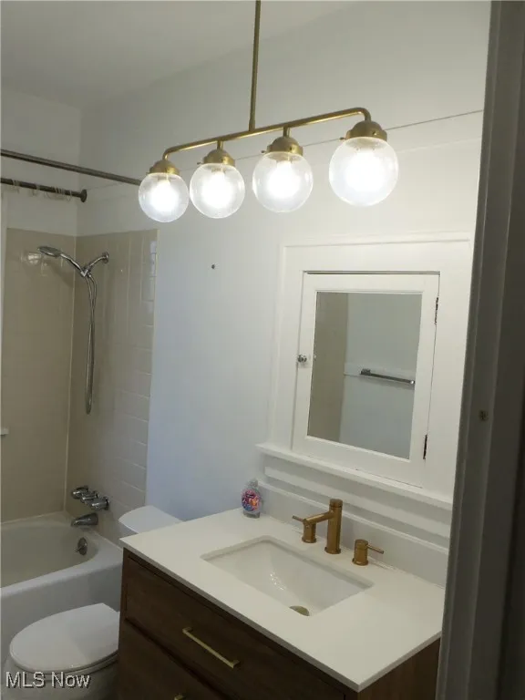 2nd. Fl. Full bath featuring vanity and shower / tub combination