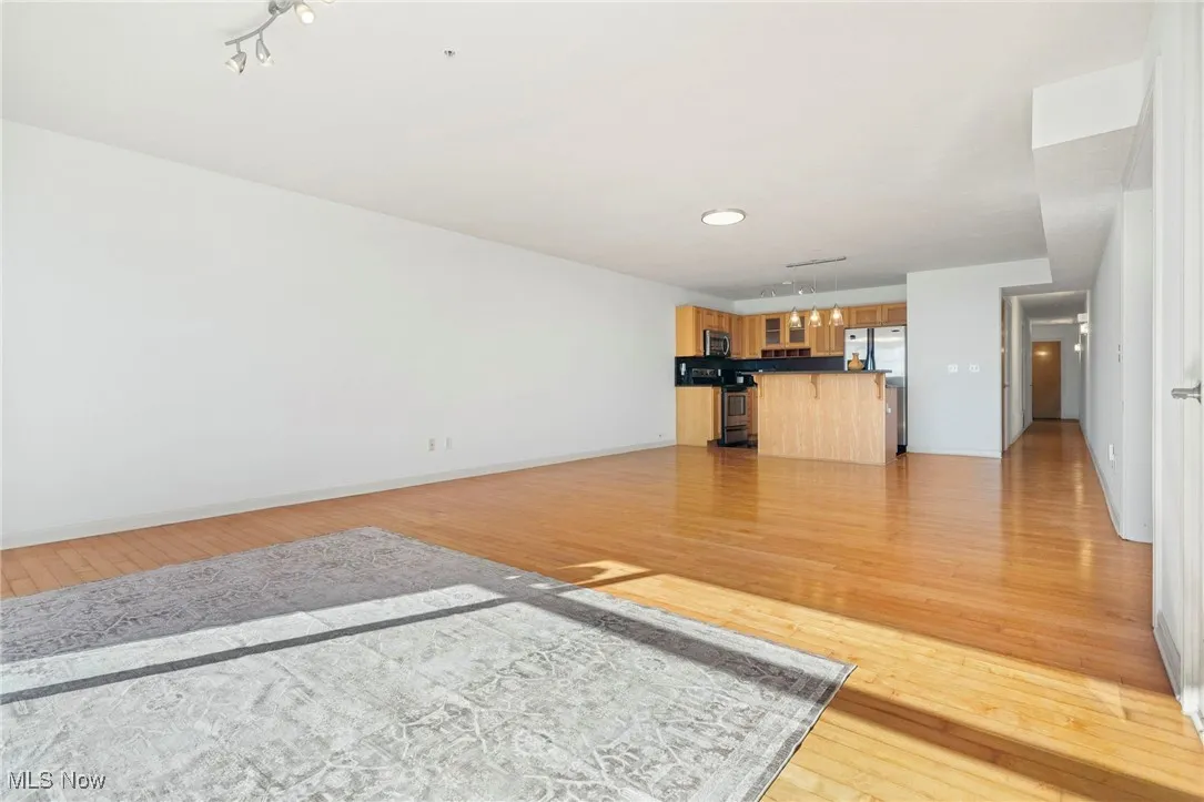 Unfurnished living room featuring light wood-type flooring and recessed lighting