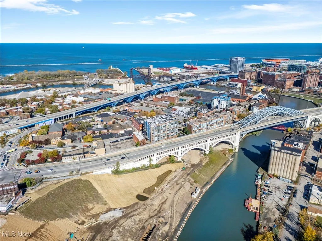 Aerial view of property's location with a notable bridge and a nearby body of water