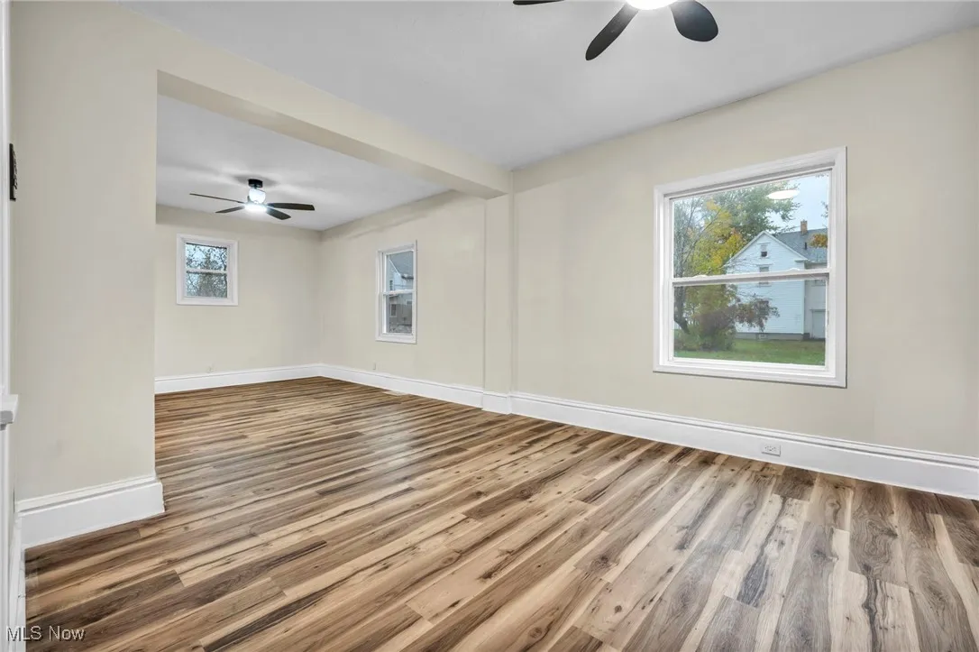 Spare room featuring a ceiling fan and light wood finished floors