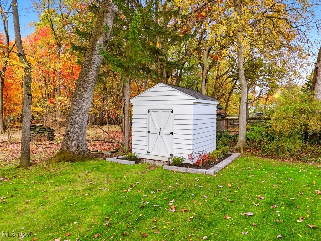 View of shed with view of wooded area