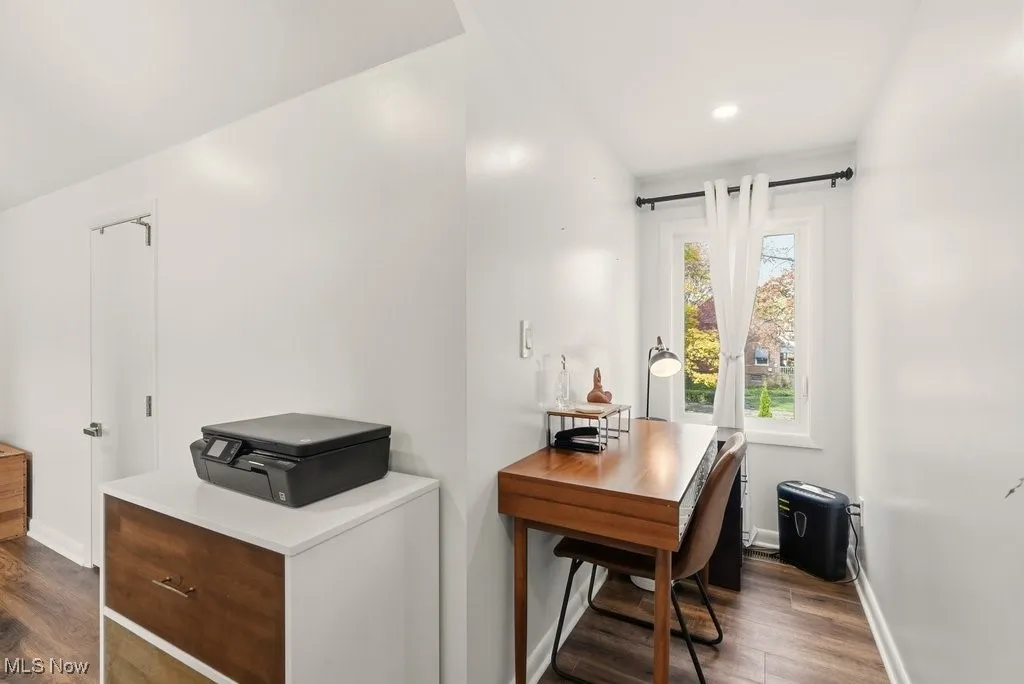 Home office featuring dark wood-style flooring and recessed lighting
