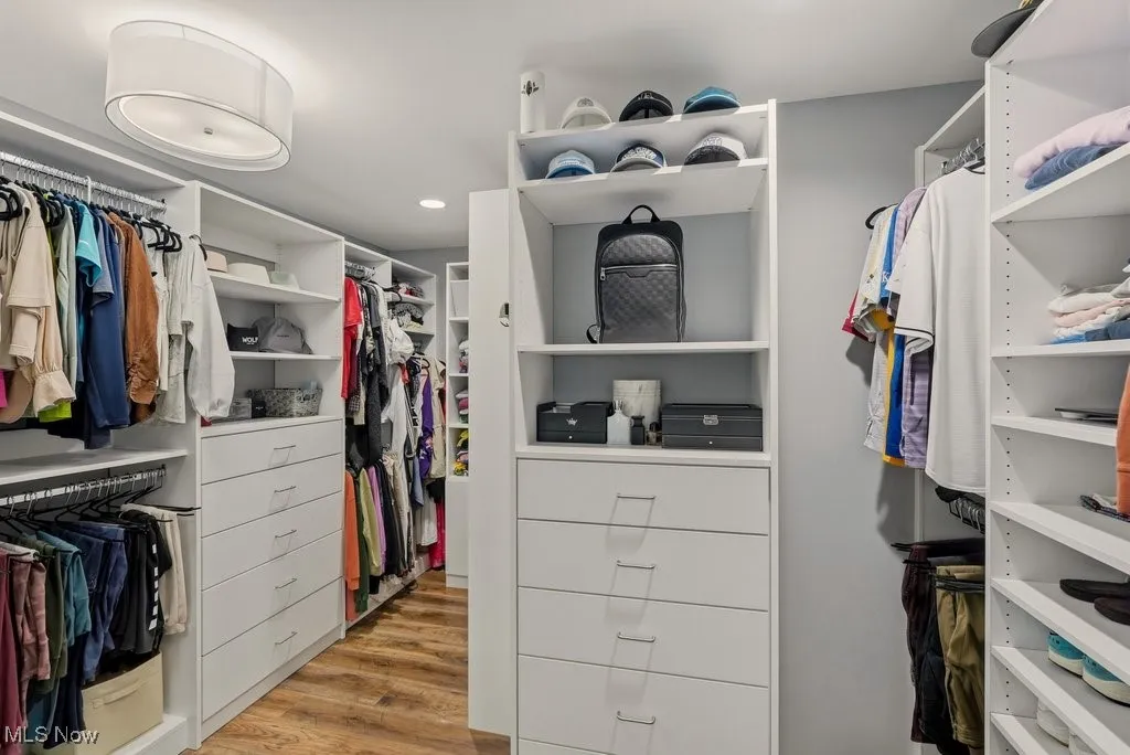 Spacious closet with light wood-style floors