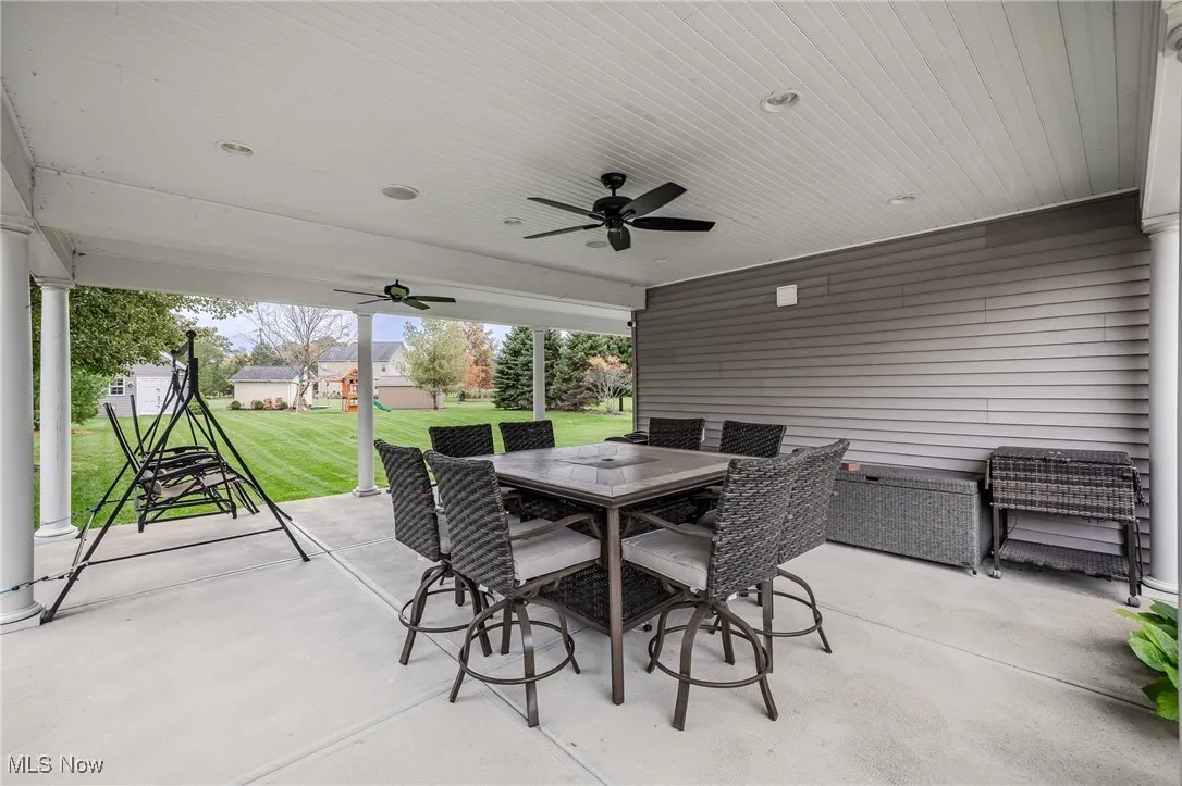 Covered porch wraps around to the back of the house