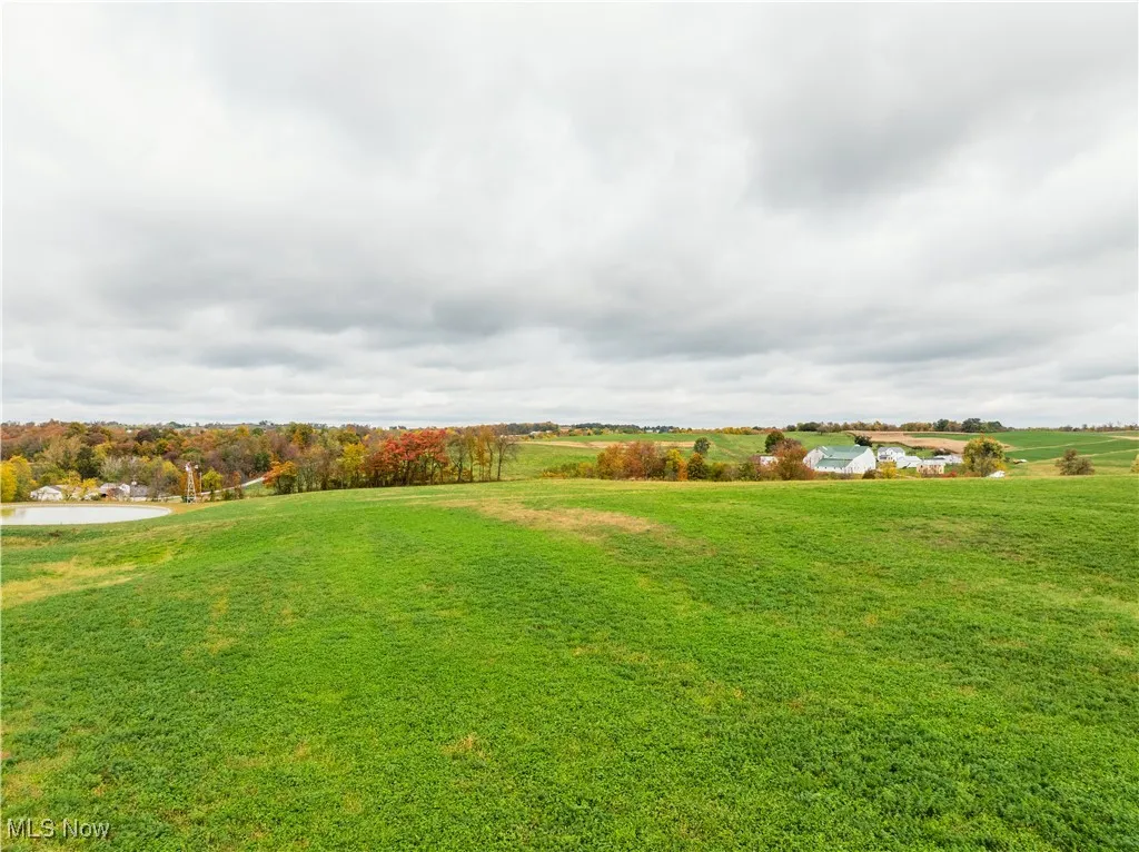 View of green lawn featuring a view of rural / pastoral area