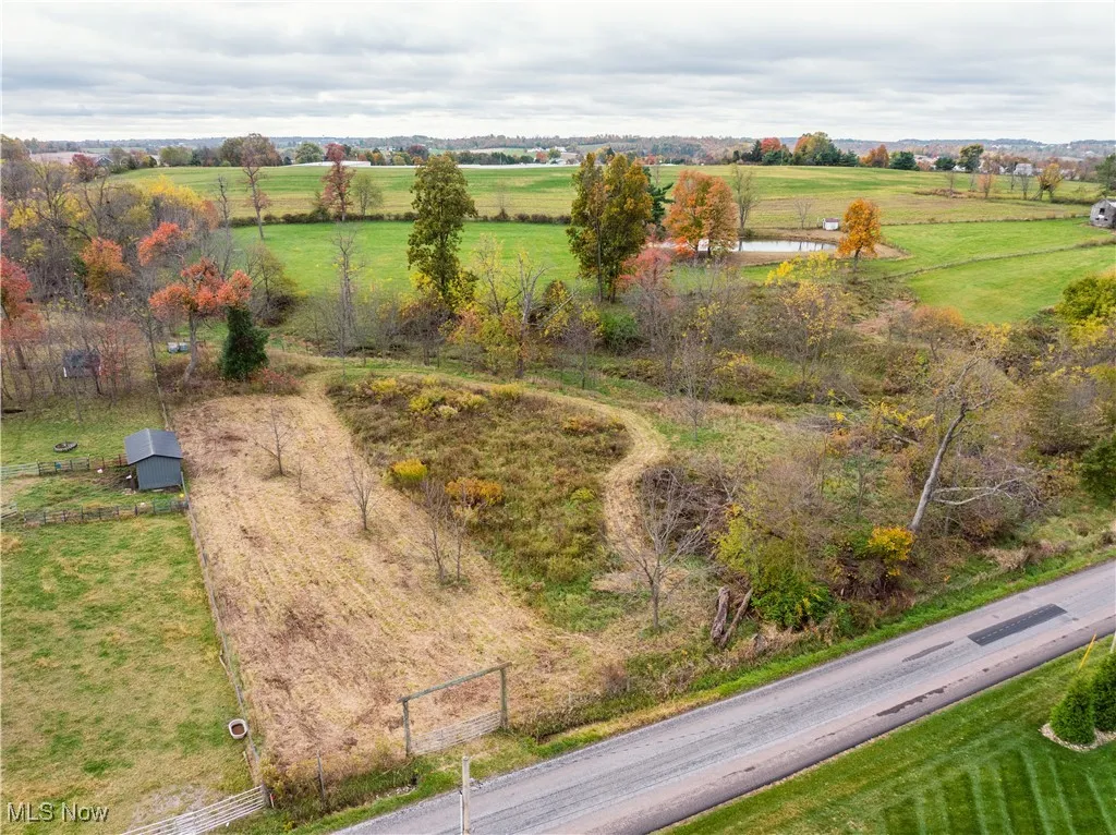Overview of rural landscape featuring a nearby body of water
