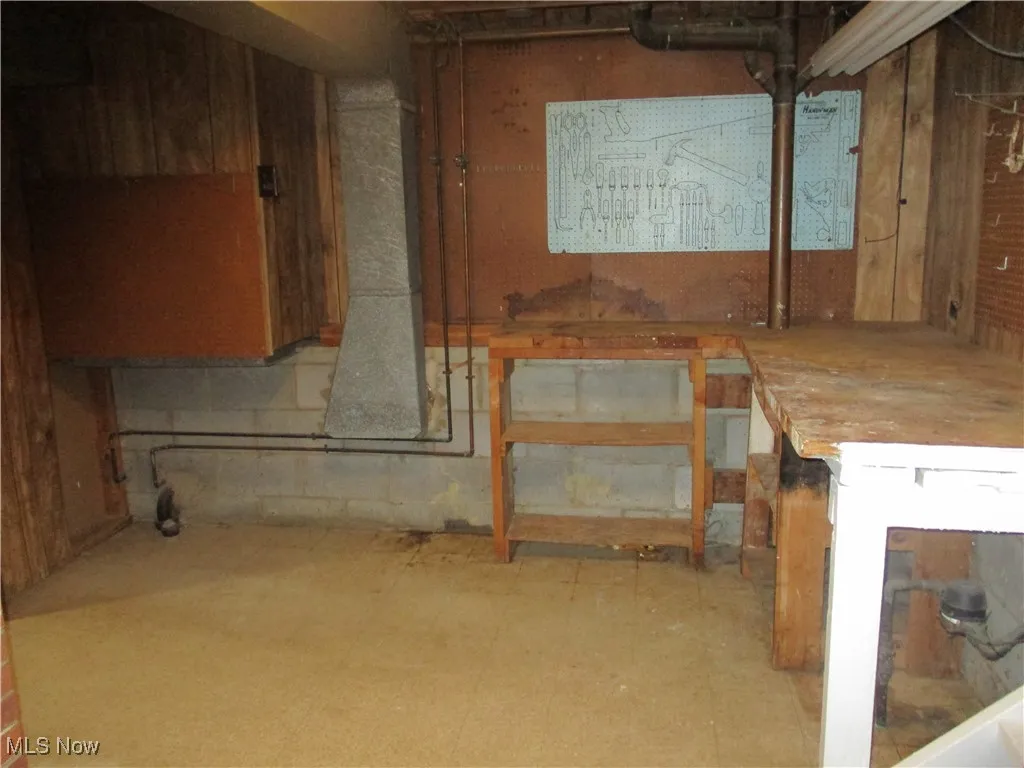 Workshop area at opposite end of the laundry room that is between the garage and family room