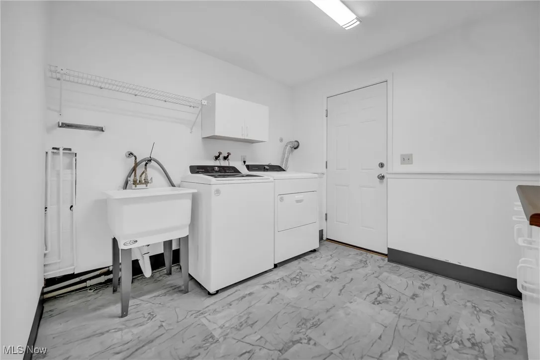 Laundry room located off first floor family room with entrance to attached garage