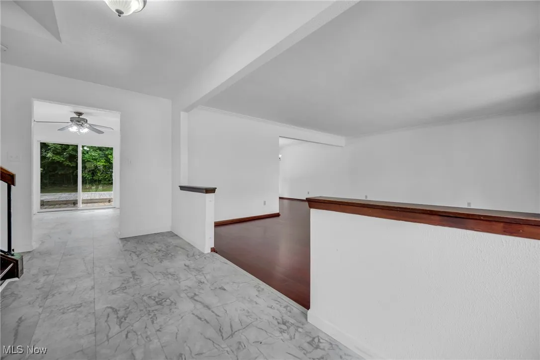 Hallway with light tile patterned floors