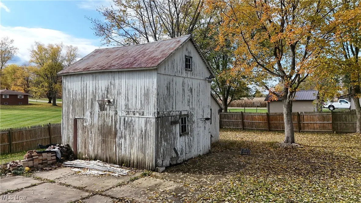 View of outdoor structure featuring a fenced backyard