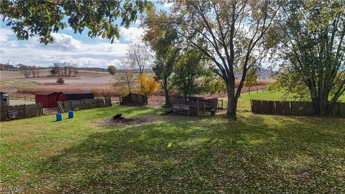 Fenced backyard with a rural view