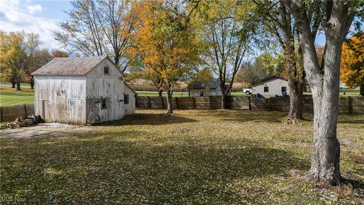 Fenced backyard with a shed