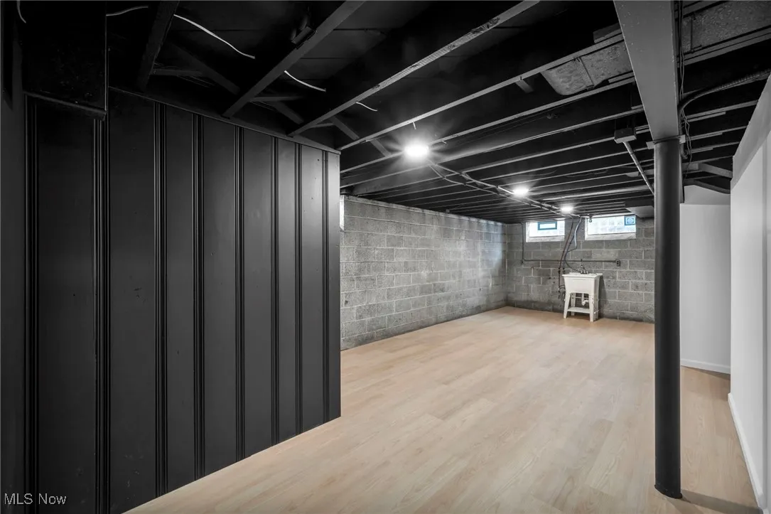 Basement with light wood-style floors